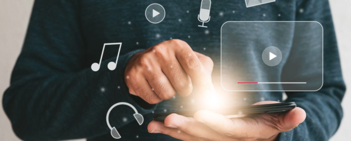 Close up hands holding smartphone. man using cellphone for streaming online watching video on internet live concert show or tutorial.technology business investment and education concept