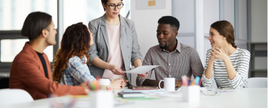 https://image.freepik.com/free-photo/female-manager-working-with-creative-team_236854-21221.jpg